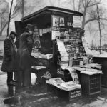 From March 1934, a news vendor’s stand in New York’s Madison Square Park offers several pulp magazines for sale. From March 1934, a news vendor’s stand in New York’s Madison Square Park offers several pulp magazines for sale.