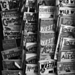 To make it easier to read the titles, we’ve flipped this photo of pulps hanging from a rack at a Manchester, N.H., shop in September 1937. To make it easier to read the titles, we’ve flipped this photo of pulps hanging from a rack at a Manchester, N.H., shop in September 1937.