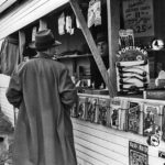 Another man talks to a vendor at a newsstand in Burbank, Calif., in early 1941. Pulps dated February 1941 are on display. Another man talks to a vendor at a newsstand in Burbank, Calif., in early 1941. Pulps dated February 1941 are on display.