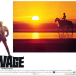 Doc Savage (Ron Ely) rides across a desert in the Republic of Hidalgo in George Pal’s 1975 film, Doc Savage: The Man of Bronze.