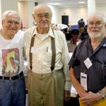 Pulpcon veterans Al Tonik, from left, Wooda “Nick” Carr and Ray Beam visit Friday morning shortly after doors to the dealers’ room open.