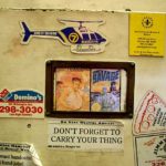 A magnet featuring the covers of the phantom “Bleeding Sun” adventure of Doc Savage hides on a filing cabinet door of Bonnett’s Books in Dayton, Ohio.
